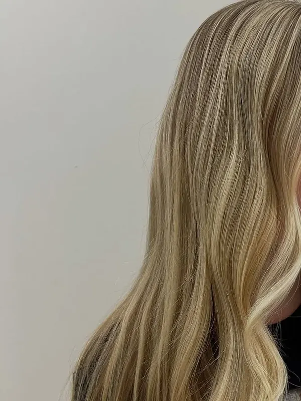 Long blonde hair with bright woven highlights, colored by Amy Kurtz